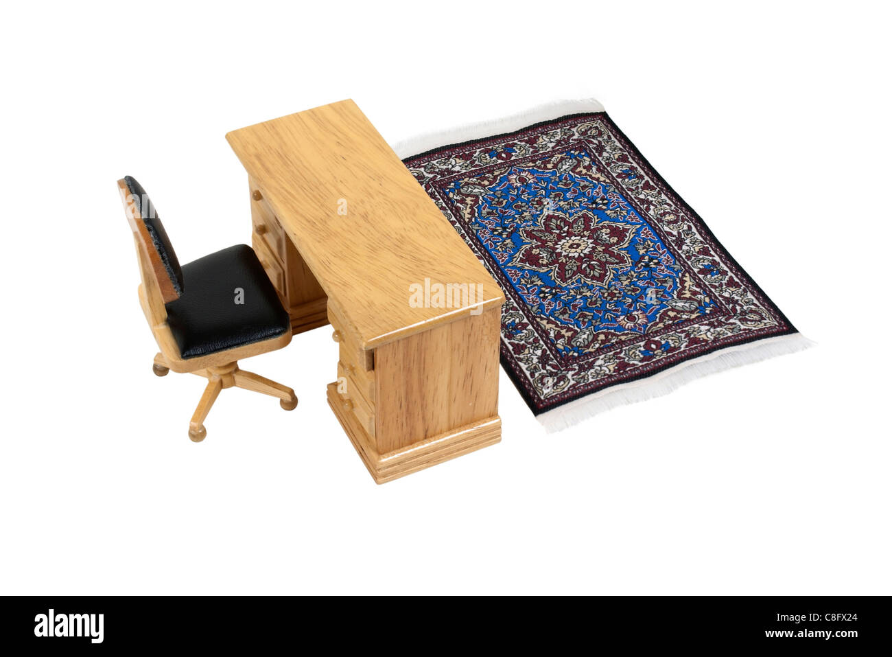 Simple office with a wooden desk and chair and a fancy rug path