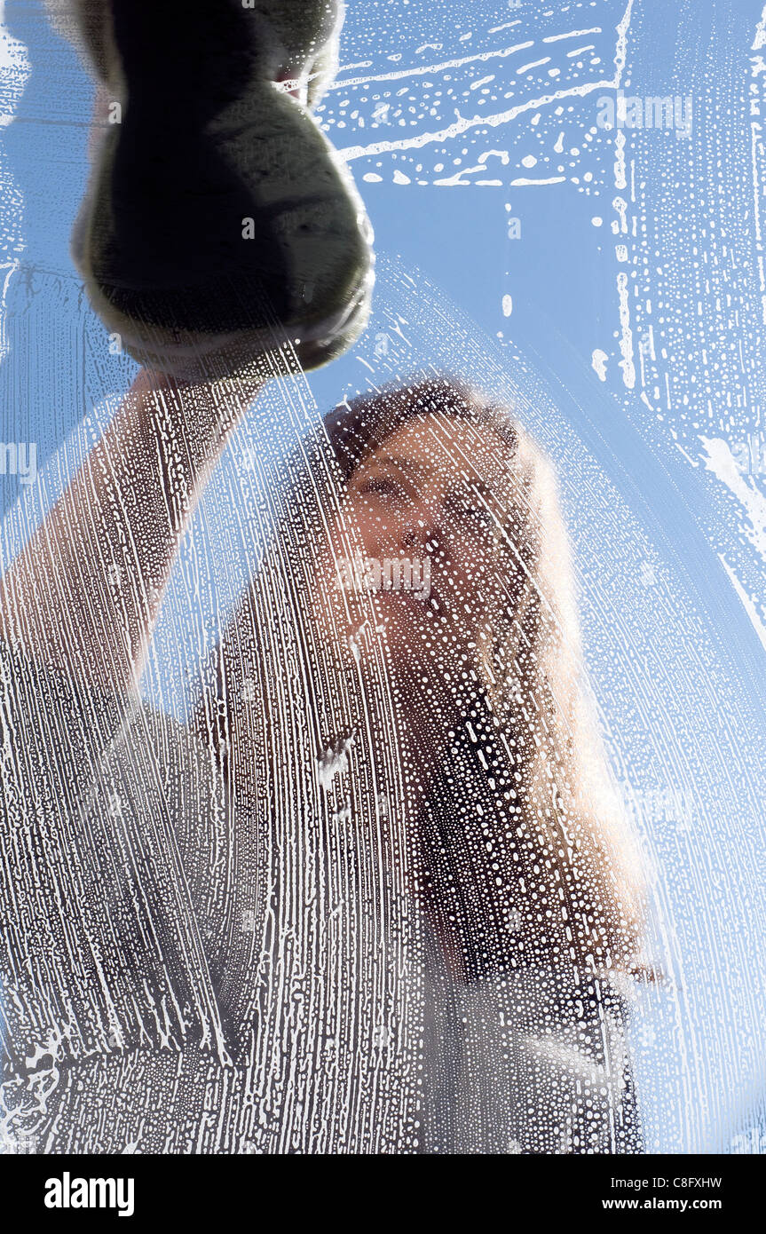 Cleaning window with sponge,clean, cleaner, cleaning agent, domestic