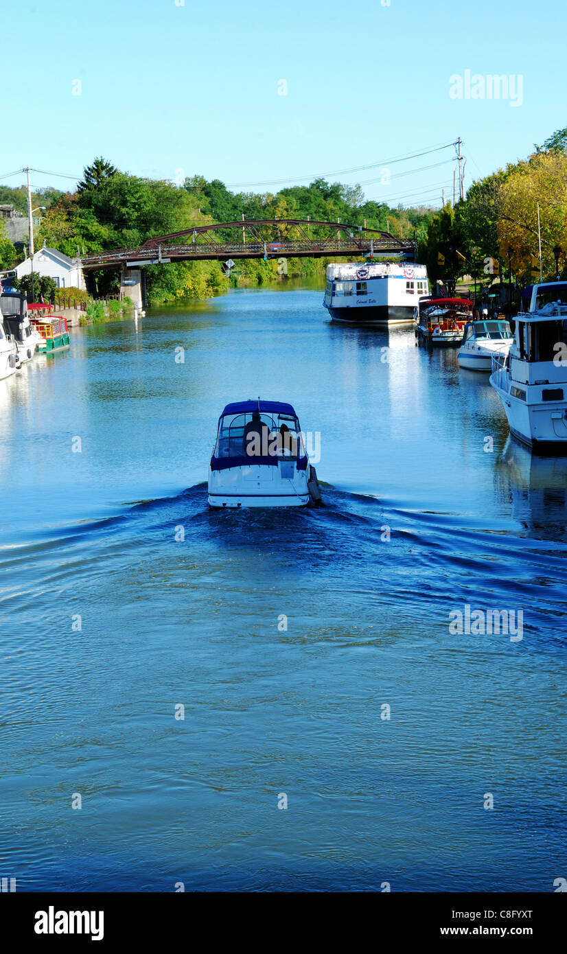 boater cruises on the Erie canal in October. Stock Photo