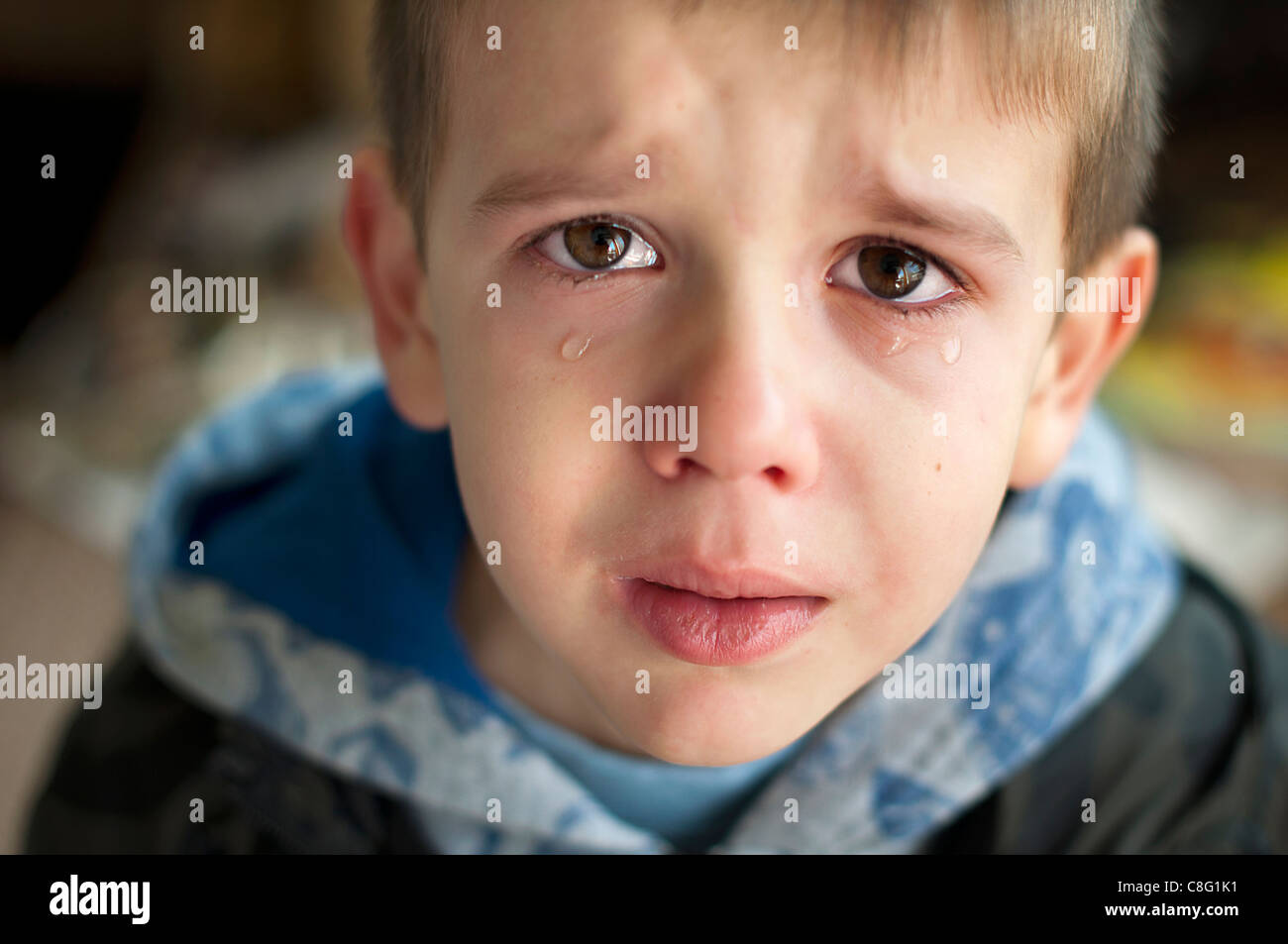 Sad child who is crying. Close up Stock Photo - Alamy
