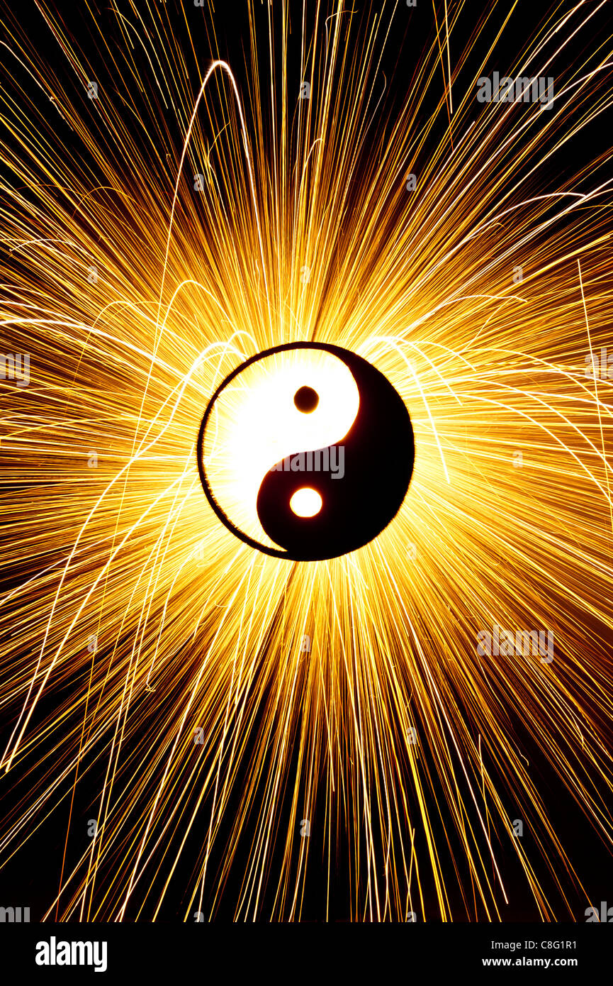 Yin Yang in front of firework sparks. Silhouette Stock Photo