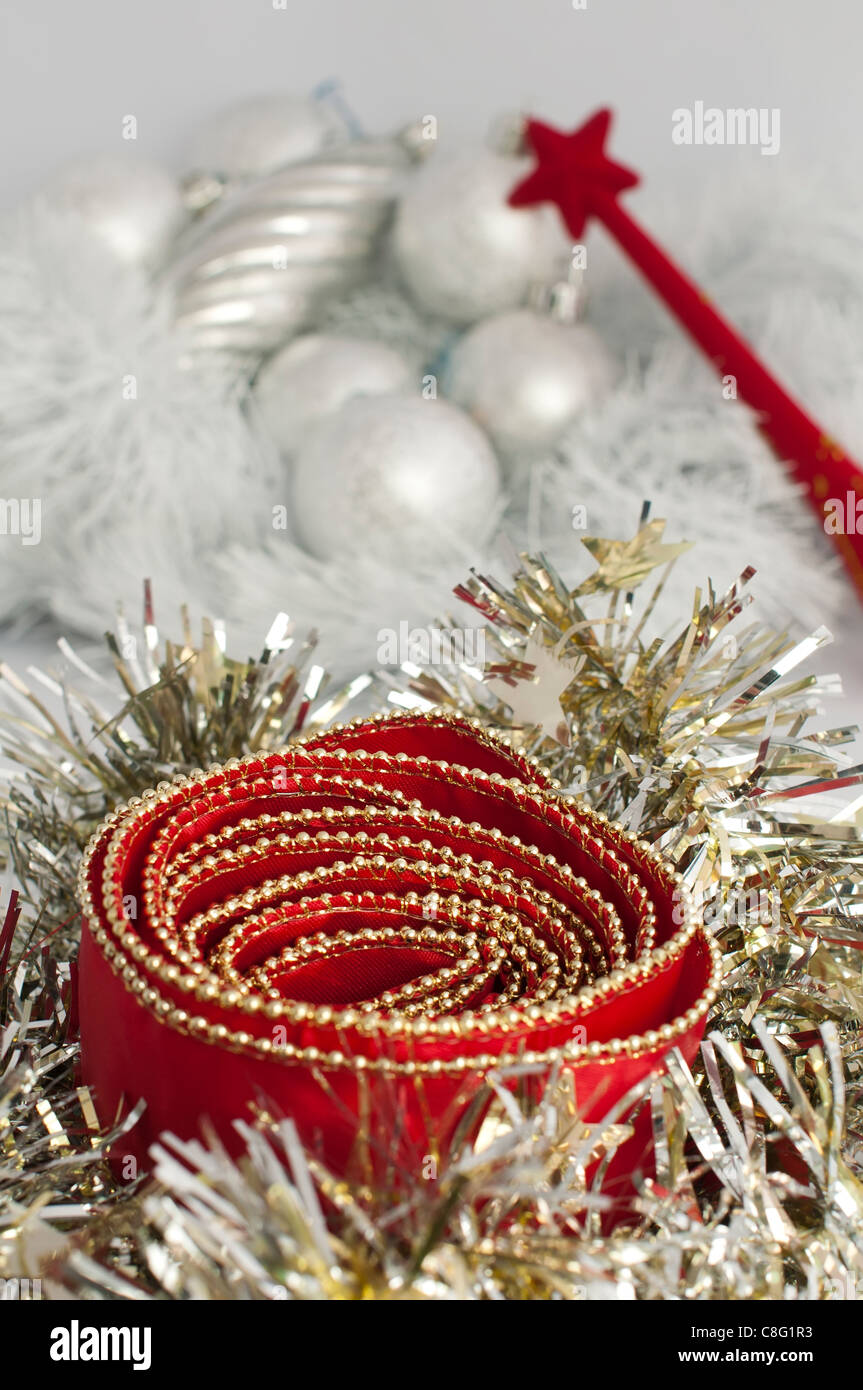 Christmas motifs with balls and chains. Red and white balls, white chains and red ribbon Stock Photo