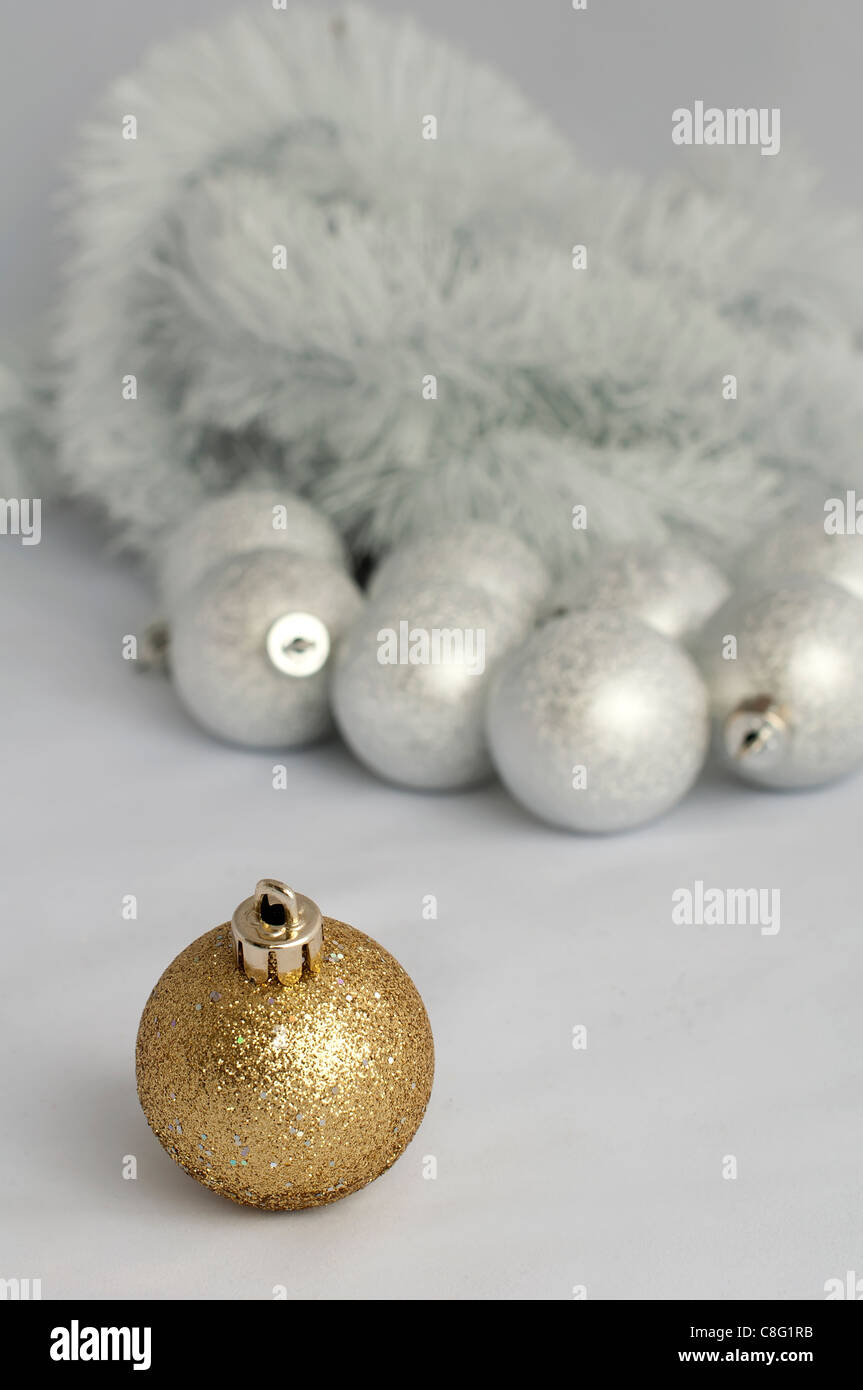 Christmas motifs with balls and chains. Red and white balls, white chains and red ribbon Stock Photo