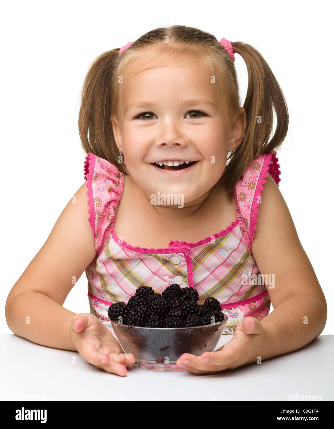 Little child eating blackberries hires stock photography and images