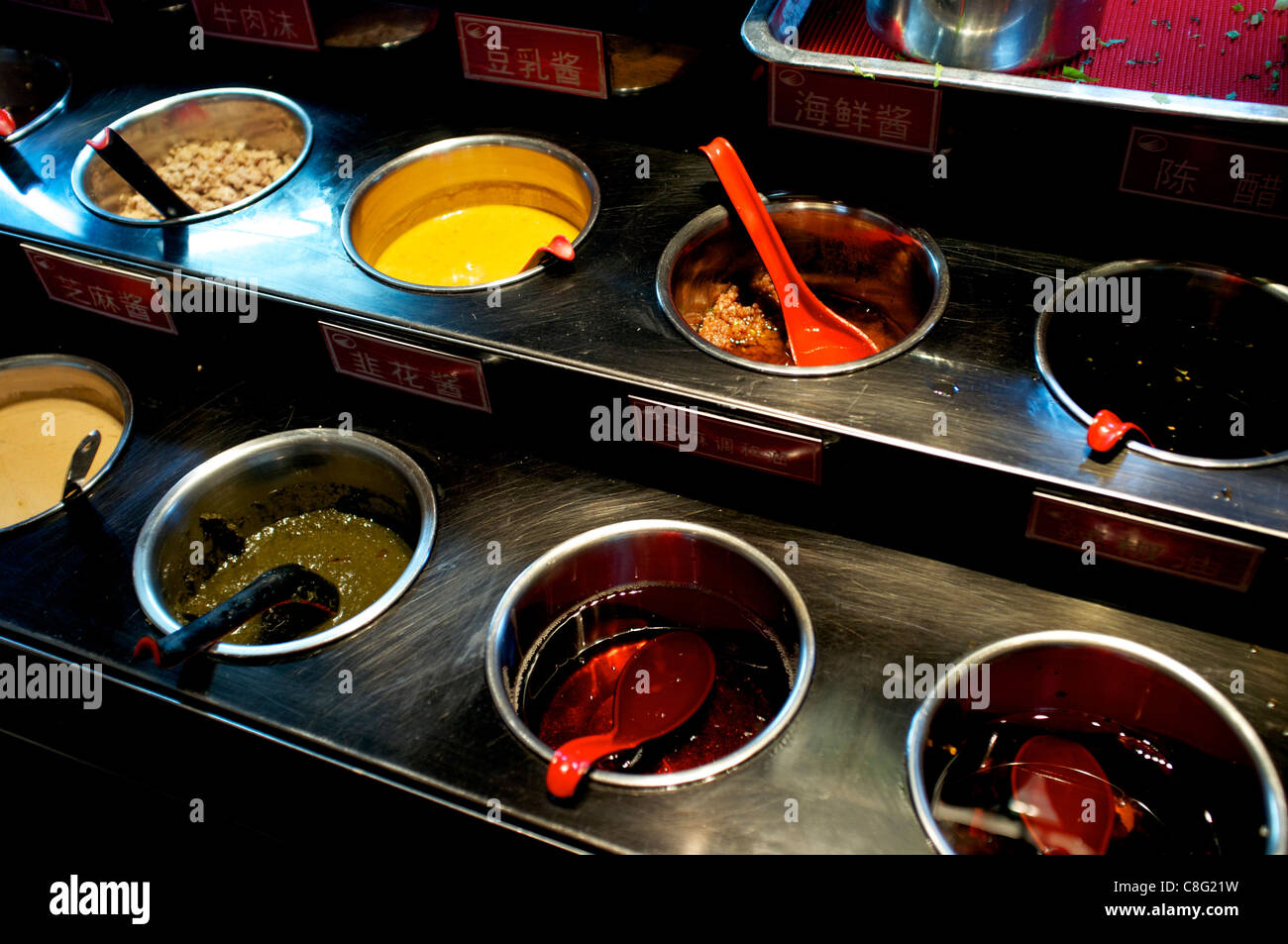 Various sauces at Hai Di Lao hot pot restaurant in Beijing, China. 21-Oct-2011 Stock Photo