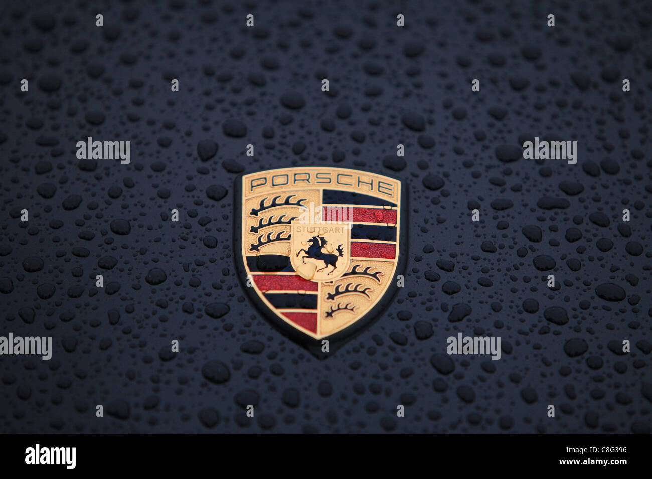 Close up of cars with rain drops on the (hood) of car Stock