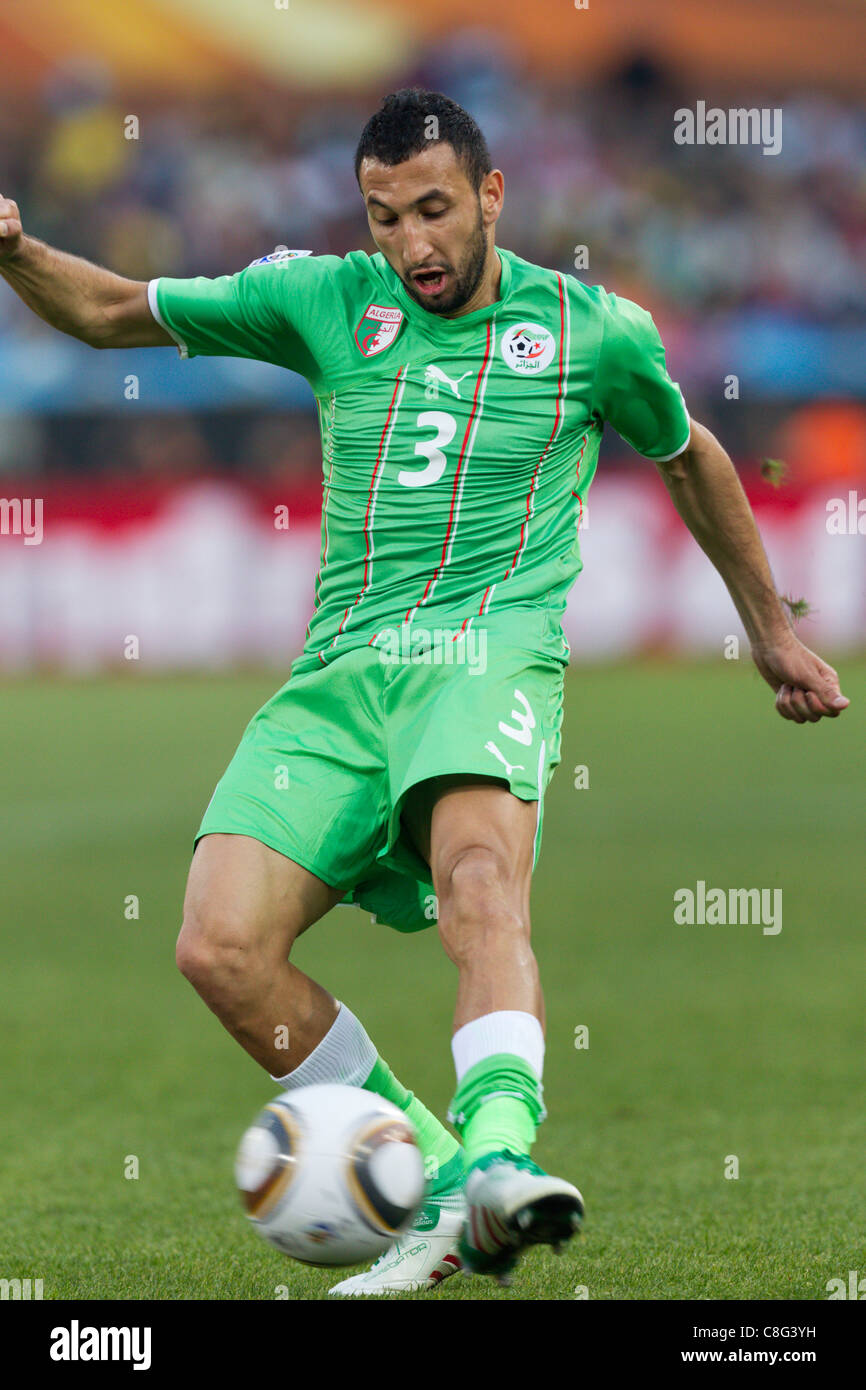 Nadir Belhadj of Algeria shoots the ball during a 2010 FIFA World Cup Group C match against the United States. Stock Photo