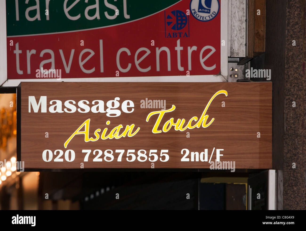 Asian Touch Massage and travel centre. signs, London, England, UK, Europe Stock Photo
