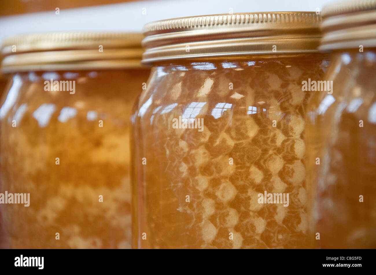 Jars of Honey on display at a honey show Stock Photo Alamy