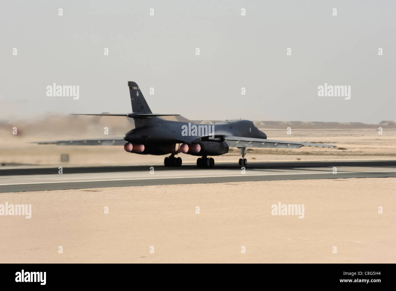 A B-1B Lancer aircrew, assigned to the 37th Expeditionary Bomb Squadron, takes off Stock Photo
