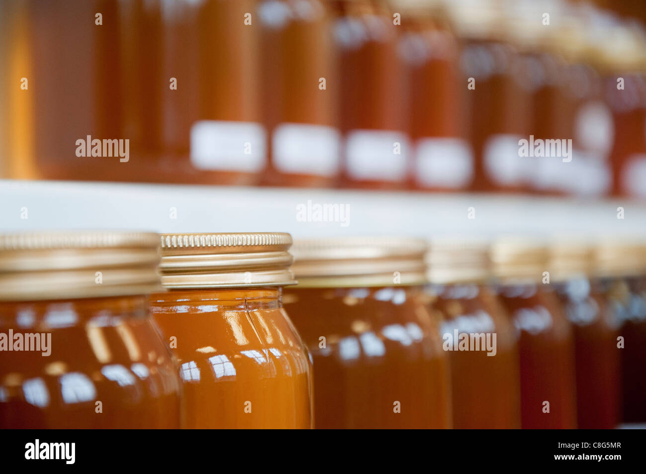 Jars of Honey on display at a honey show Stock Photo