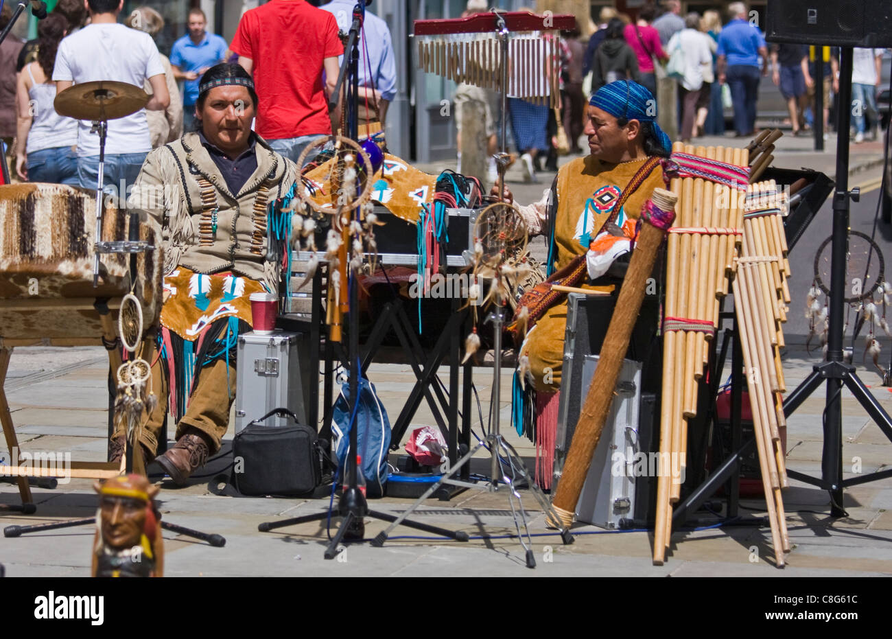 Peruvian musicians play pan pipes busking in Salisbury and playing