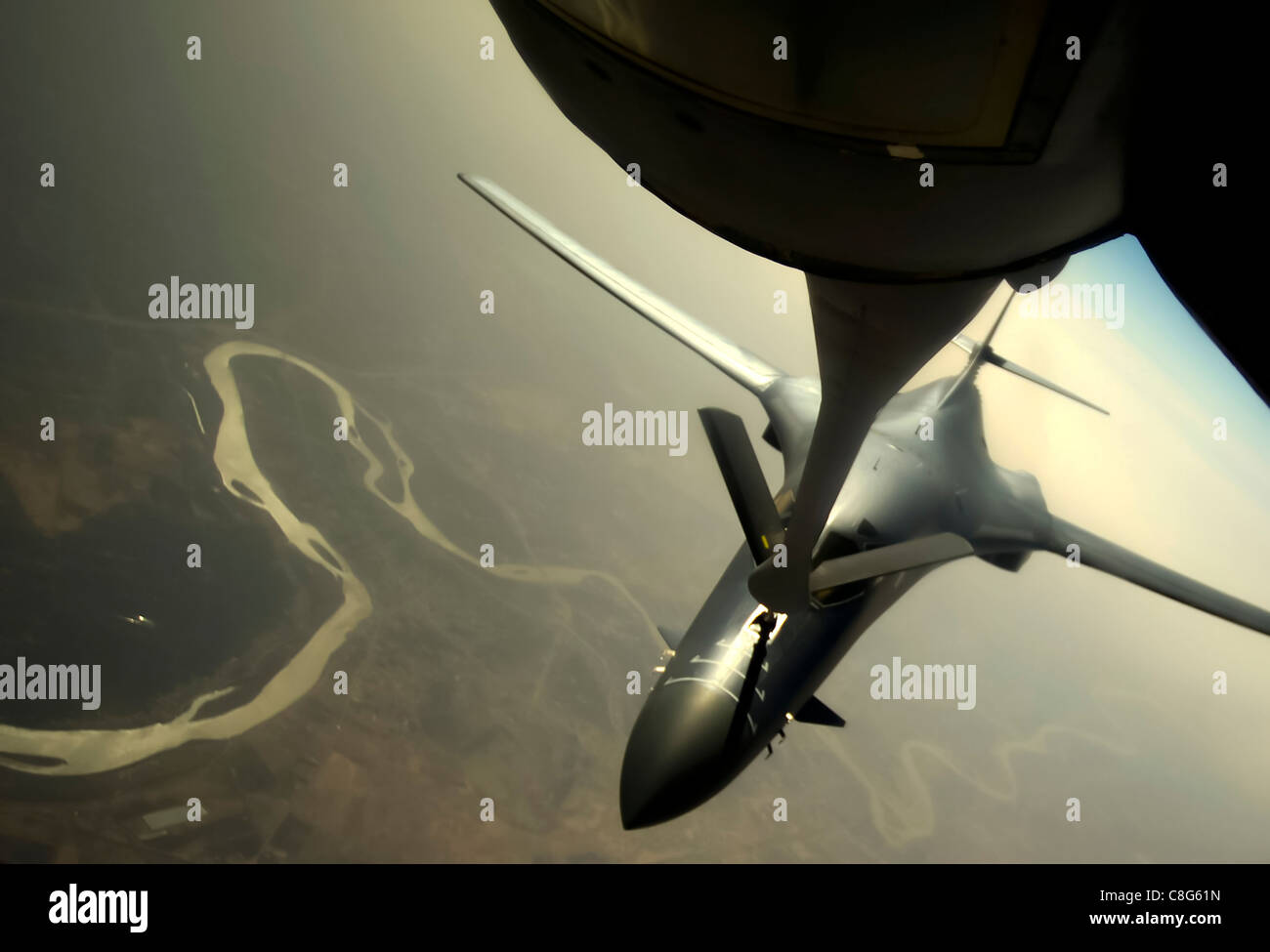 A B-1B Lancer is refueled by a KC-135 Stratotanker Feb 26, 2011, above Iraq, in support of Operation New Dawn. Stock Photo