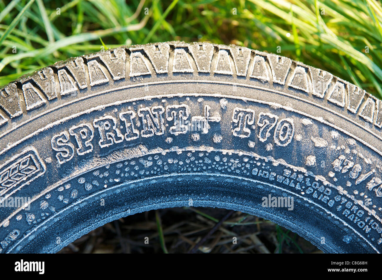 Old tire with soft rime in the morning on a farm in Germany. Stock Photo