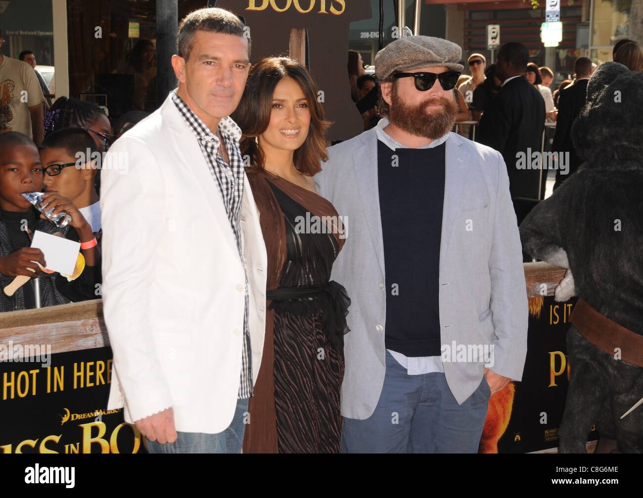 Salma Hayek, Antonio Banderas, Zach Galifanakis at arrivals for PUSS IN BOOTS Premiere, Regency Village Theater in Westwood, Los Angeles, CA October 23, 2011. Photo By: Dee Cercone/Everett Collection Stock Photo