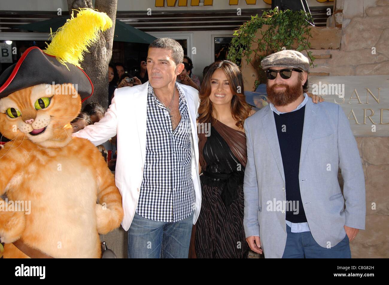Antonio Banderas, Zach Galifianakis, Salma Hayek at arrivals for PUSS IN BOOTS Premiere, Regency Village Theater in Westwood, Los Angeles, CA October 23, 2011. Photo By: Michael Germana/Everett Collection Stock Photo