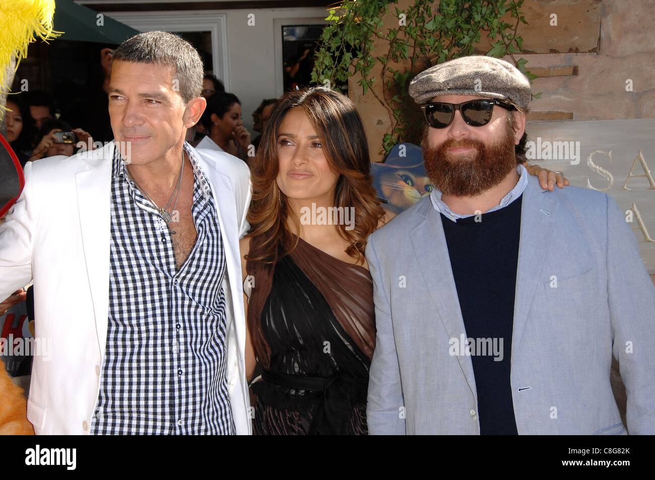 Antonio Banderas, Zach Galifianakis, Salma Hayek at arrivals for PUSS IN BOOTS Premiere, Regency Village Theater in Westwood, Los Angeles, CA October 23, 2011. Photo By: Michael Germana/Everett Collection Stock Photo