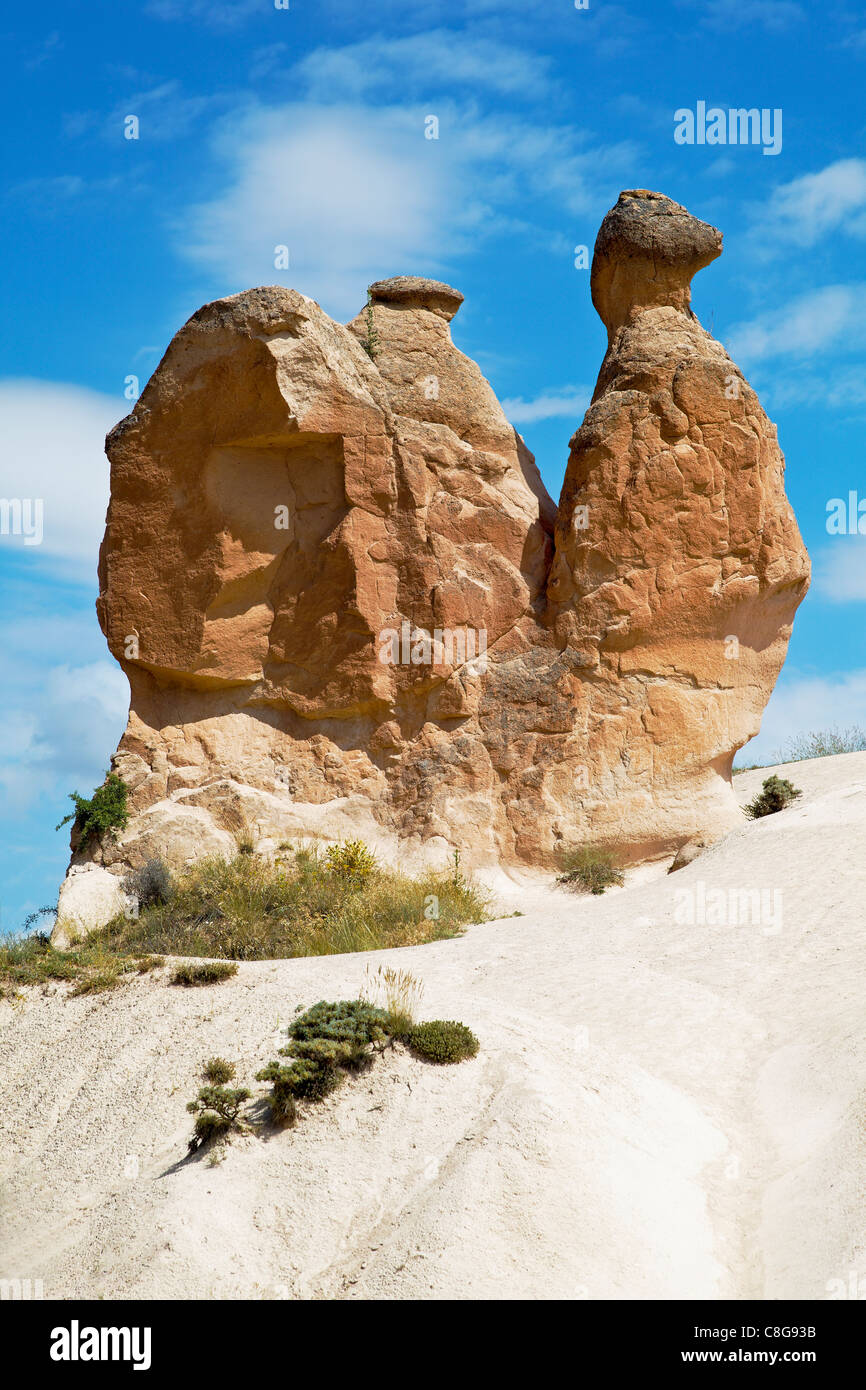 strange unusual natural volcanic sandstone rock formation slug snail mollusca, Cappodocia Turkey Portrait rich blue sky clouds Stock Photo