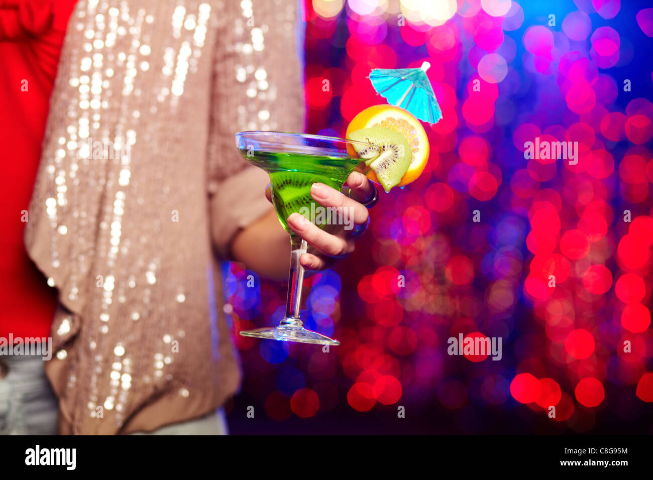 Hand holding cocktail umbrella hi-res stock photography and images - Alamy