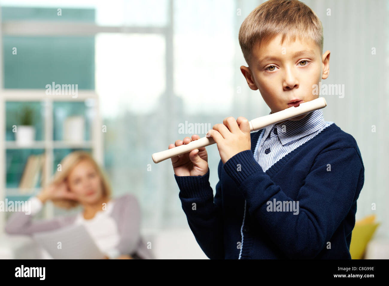 Little boy playing flute hires stock photography and images Alamy