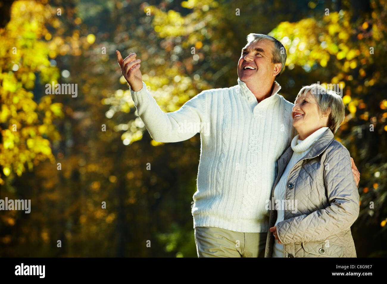 Photo of senior couple in the park in autumn Stock Photo - Alamy