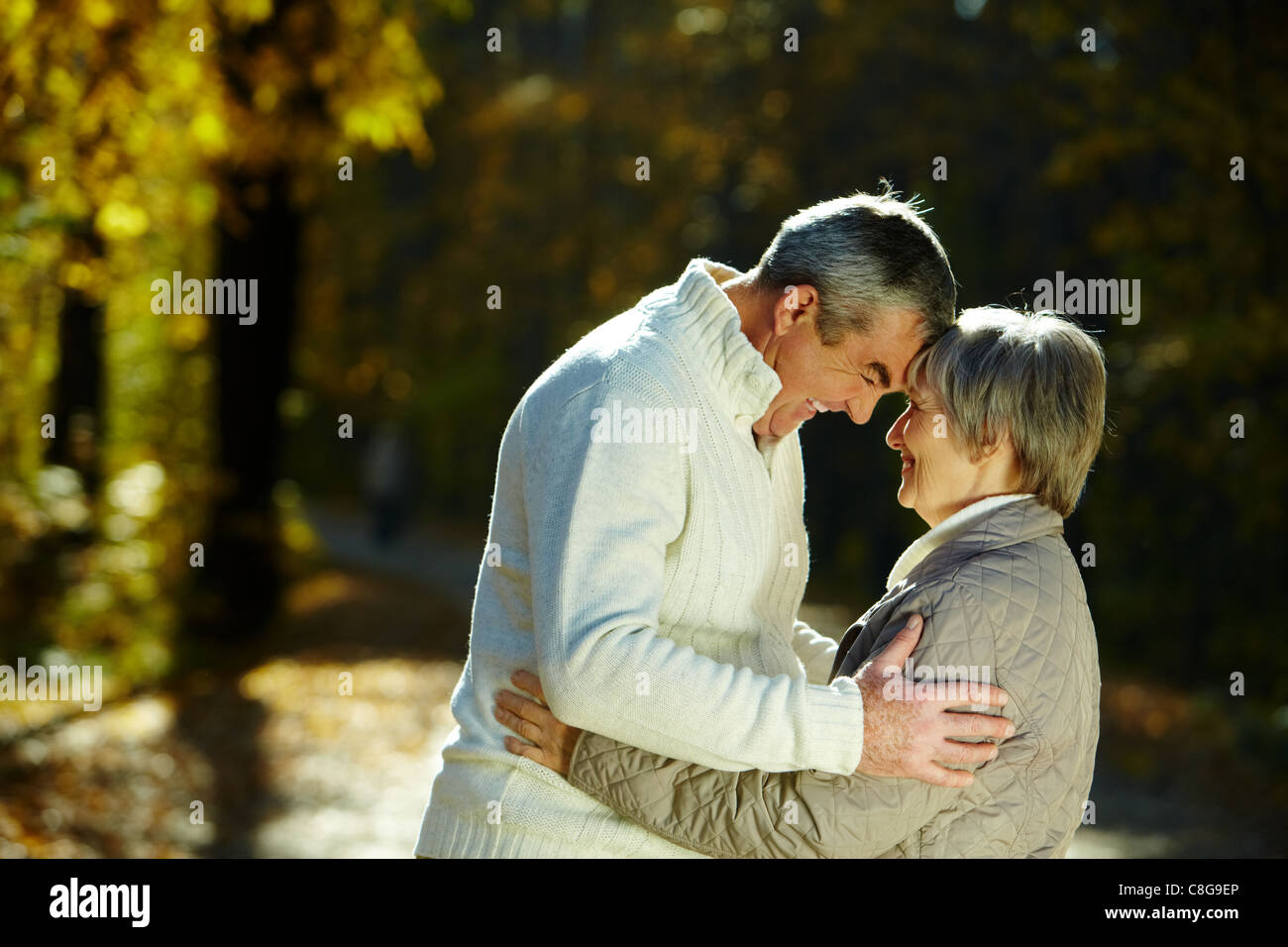 Photo of senior couple in the park in autumn Stock Photo - Alamy