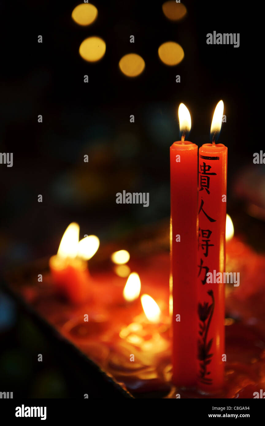Candle offerings in Buddhist temple, Ho Chi Minh City, Vietnam