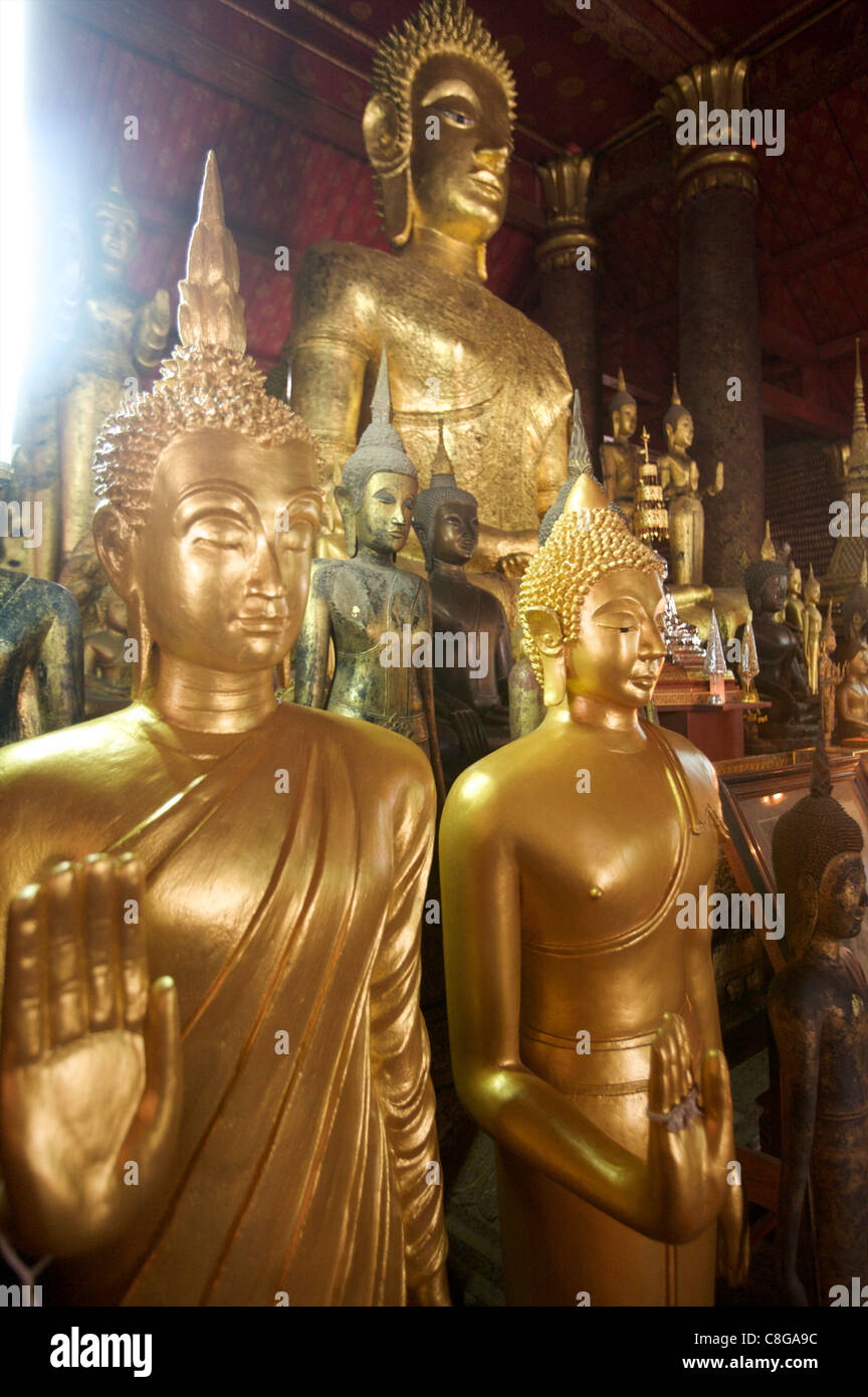 Golden Buddhas of the Royal Palace temple of Luang Prabang, Laos, Indochina, Southeast Asia Stock Photo