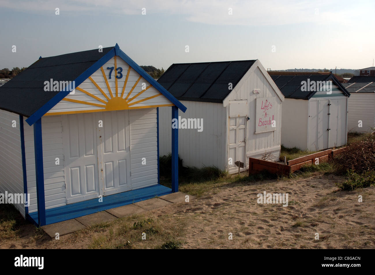 Beach huts at Heacham in Norfolk, with one named "Life's a Beach Stock