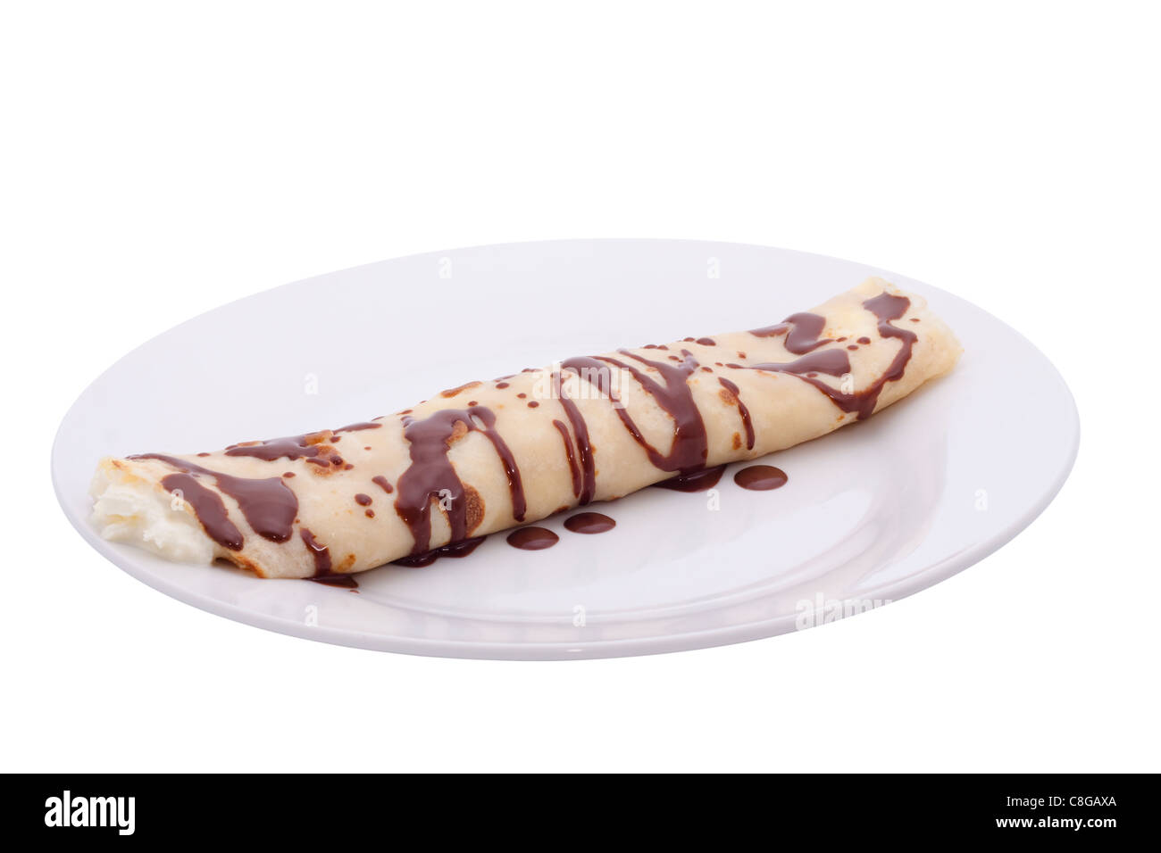 Rolled crepe with cream and chocolate, isolated on white background. Stock Photo