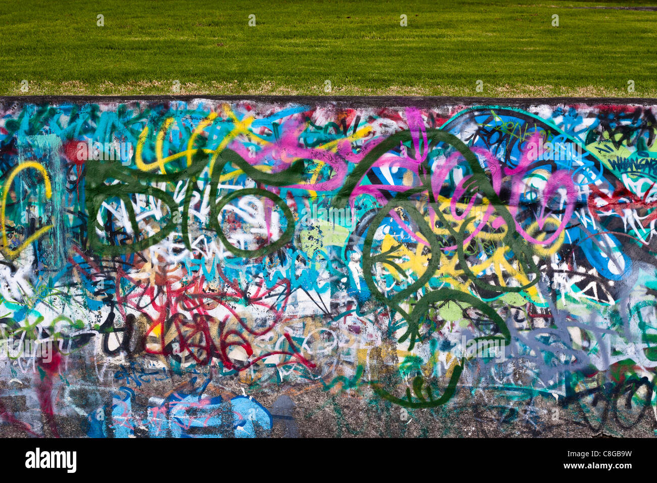 Detail of colorful urban graffiti wall. Stock Photo