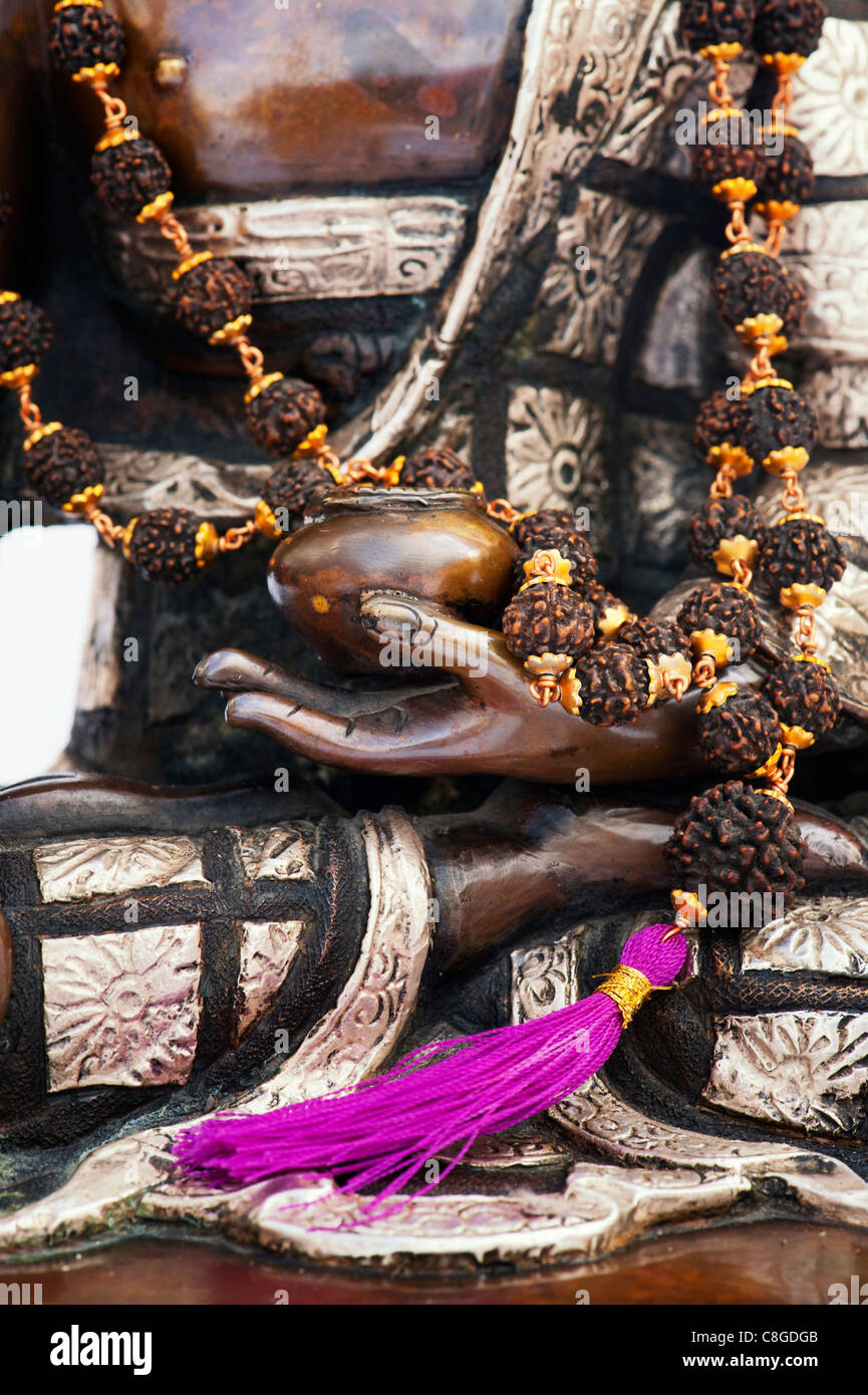 Buddha statue with Indian Rudraksha / Japa Mala prayer beads Stock Photo