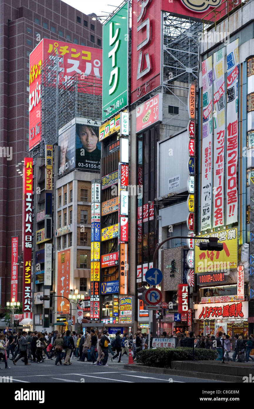 Neon signs light up the Kabukicho entertainment district in Shinjuku, Tokyo, Japan Stock Photo