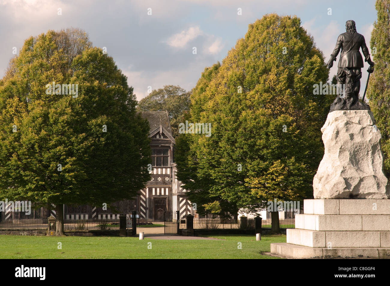 Statue of Oliver Cromwell with Wythenshawe Hall in the distance.Wythenshawe Park, Manchester. Stock Photo
