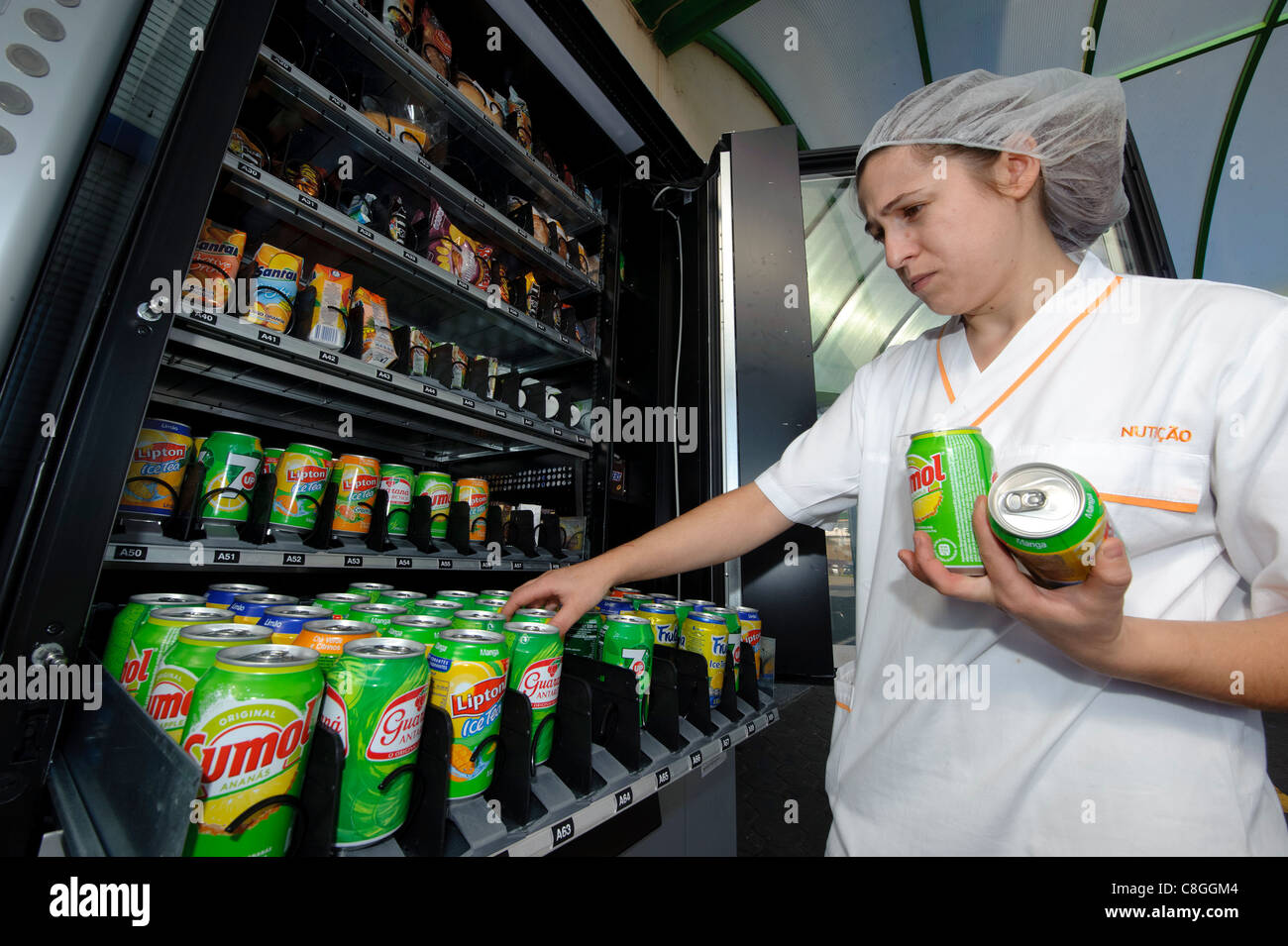 Woman restocking vending machine Stock Photo Alamy