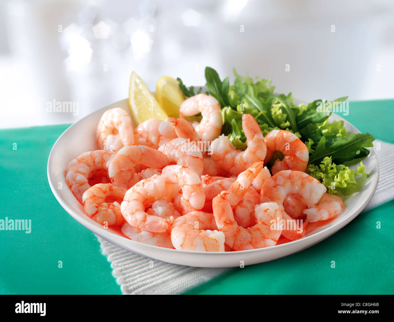 Fresh cooked prawns & salad served on a plate ready to eat Stock Photo