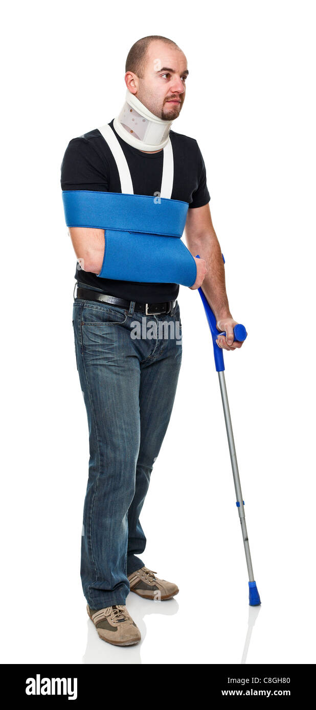 young man with crutch isolated on white Stock Photo