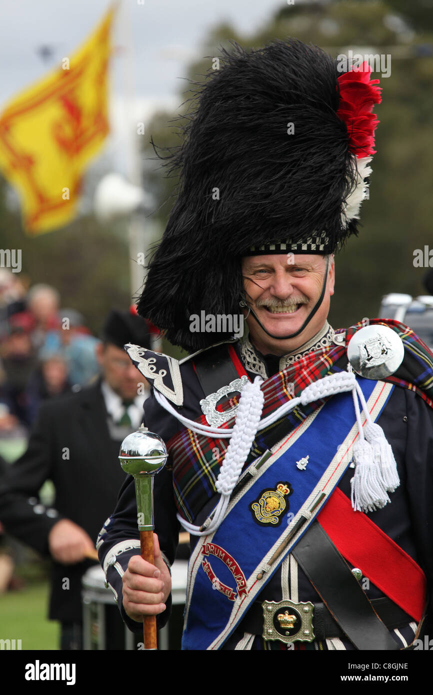 Village of Braemar, Scotland. Drum Major Bill Barclay from the Grampian Police Pipe Band at the Braemar Gathering games. Stock Photo