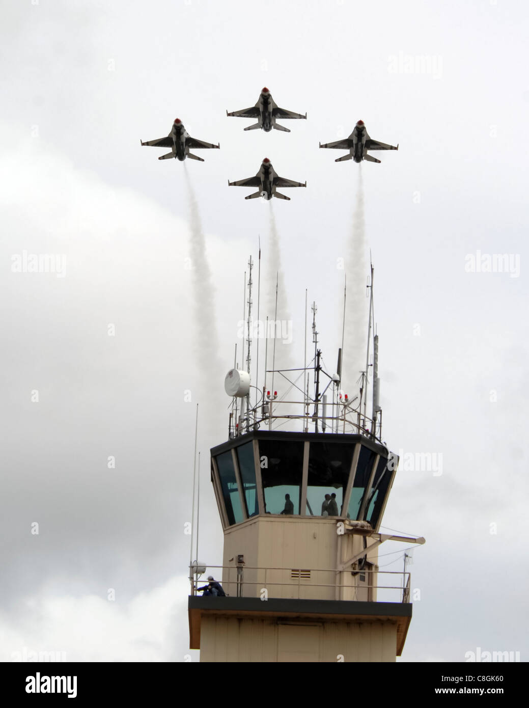 The U.S. Air Force Thunderbirds flight demonstration team flies over the Red-Flag Alaska tower during the 2008 'Soaring into Solstice' Thunderbirds Show June 24 at Eielson Air Force Base, Alaska, June 24. The Thunderbirds are assigned to the U.S. Air Force Air Demonstration Squadron at Nellis AFB, Nev. Stock Photo