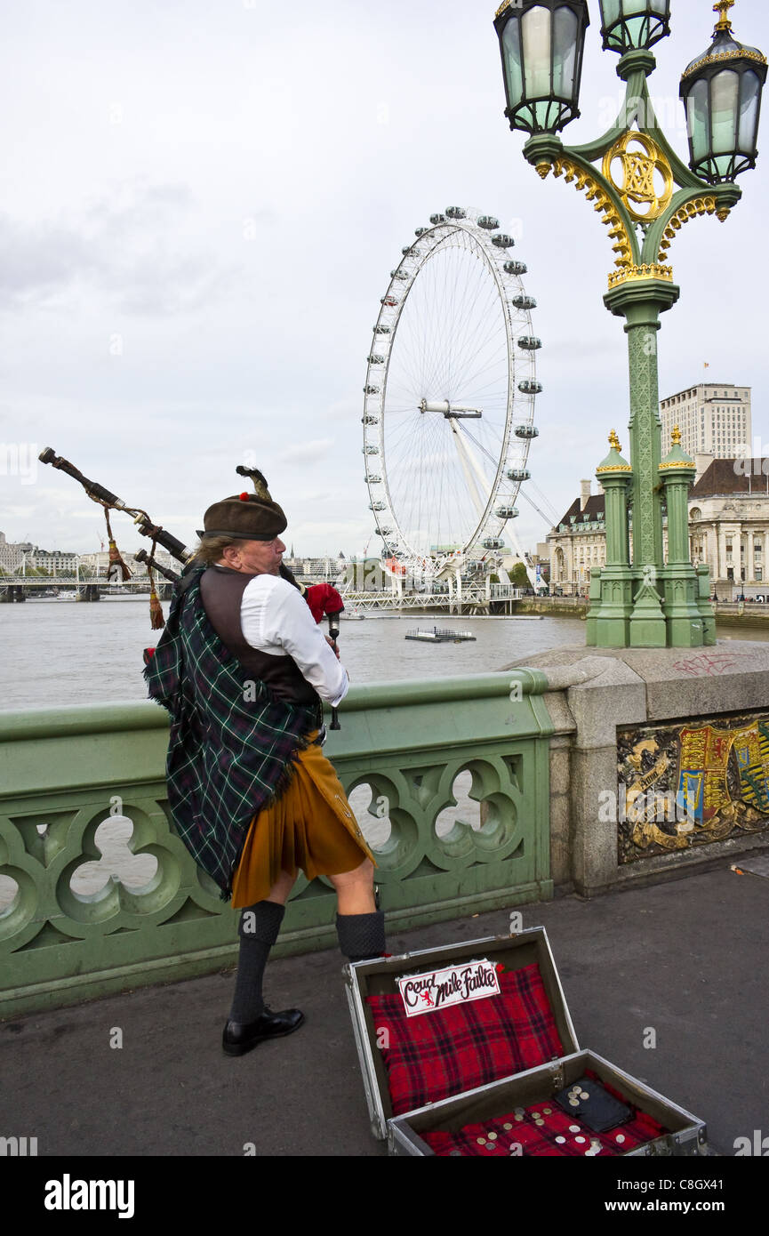 Bagpipe player on Westminster Bridge in London Stock Photo Alamy
