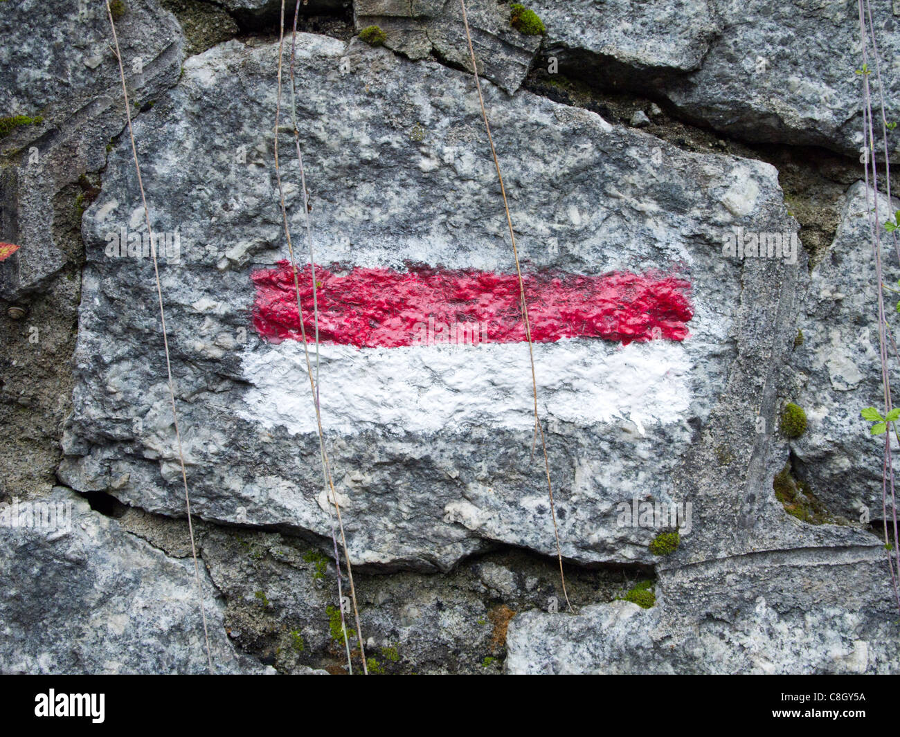 Trail marker on a stone wall, Tour of Mont Blanc. Courmayeur, Italy Stock  Photo - Alamy