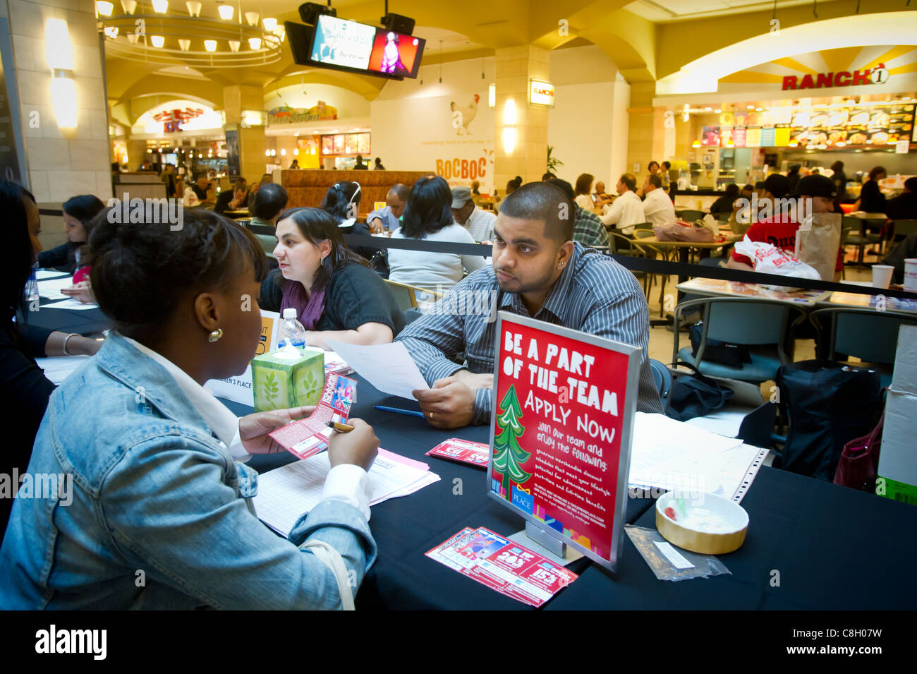 Job seekers attend a job fair for seasonal work at a mall in the