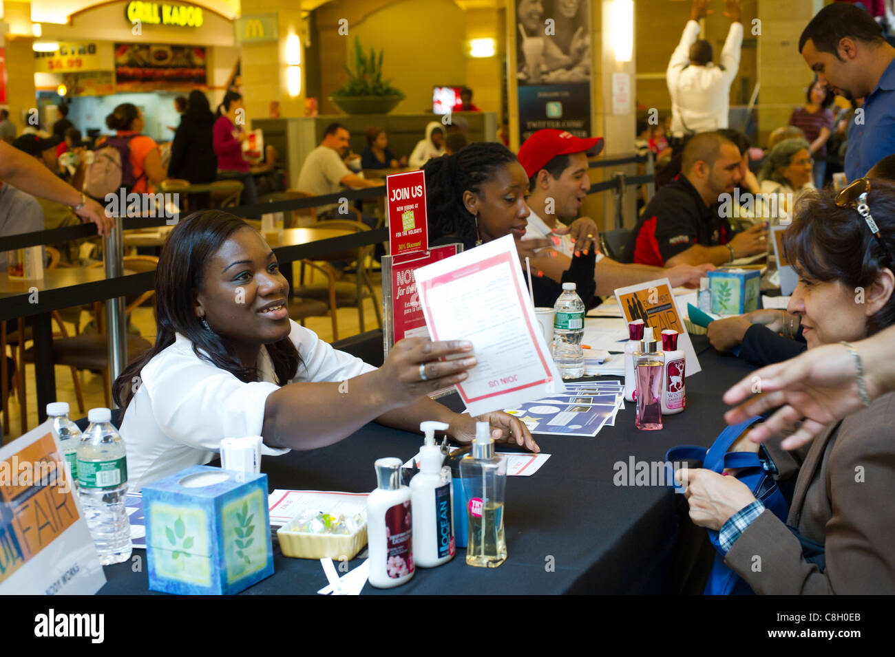 Job seekers attend a job fair for seasonal work at a mall in the