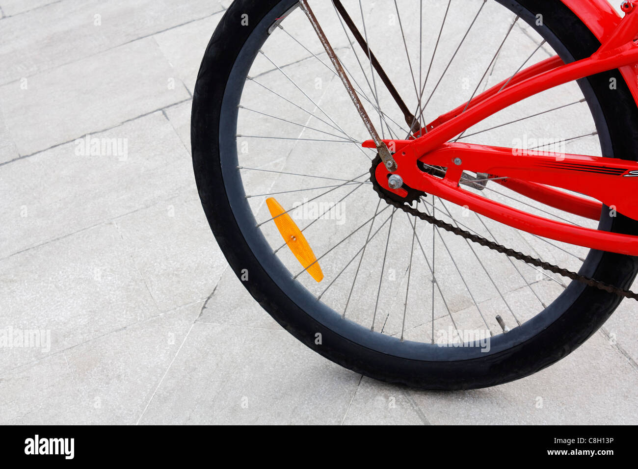 A detail of a red bike - rear wheel Stock Photo - Alamy