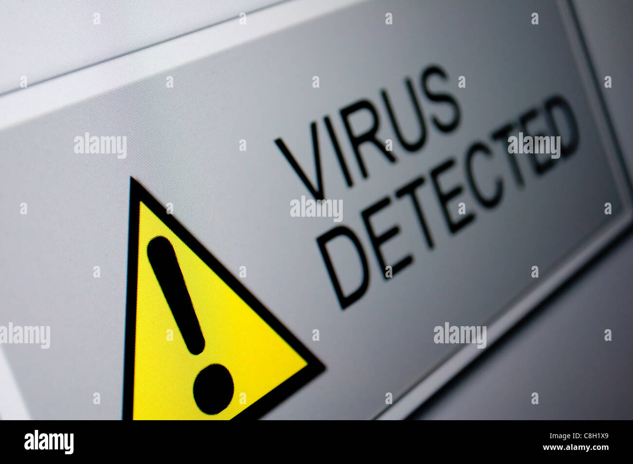 Closeup of Virus Detected Sign on LCD Screen Stock Photo