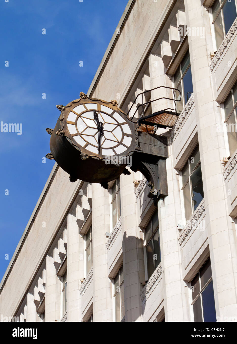 Clock outside Debenhams department store in Manchester England UK Stock Photo
