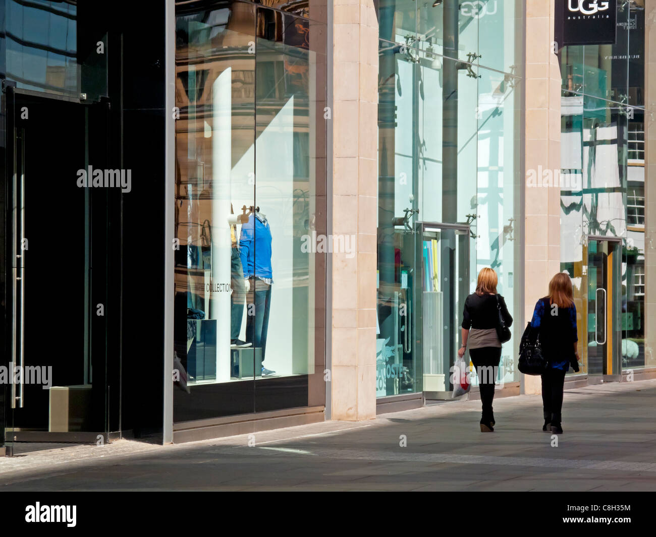 Shoppers in New Cathedral Street shopping centre in Manchester city centre England UK Stock Photo
