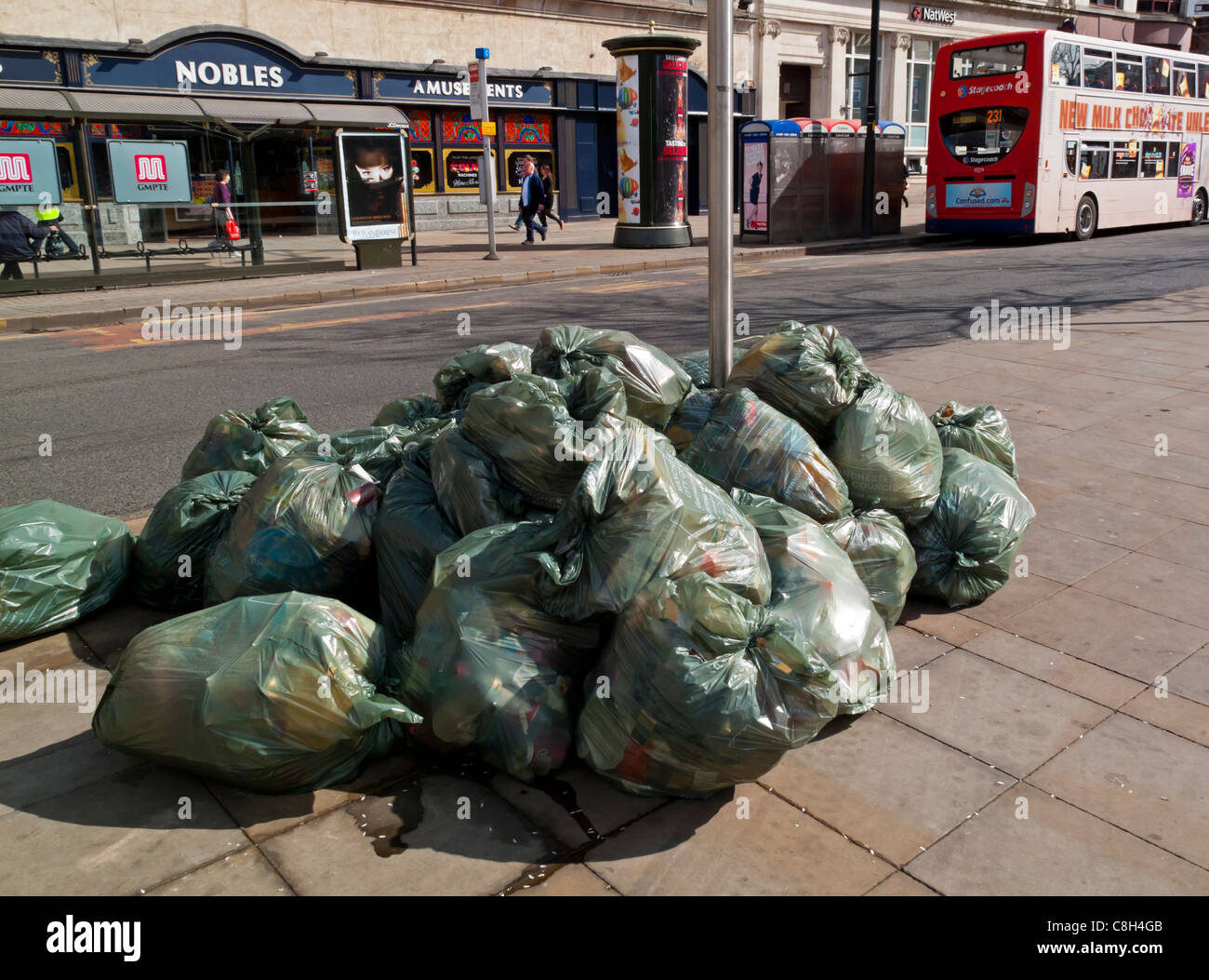 Three big blacks trash bags in front of wall Stock Photo - Alamy
