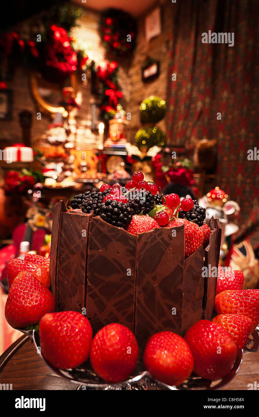 A delicious berry and chocolate cake ready for devouring at Christmas Stock Photo