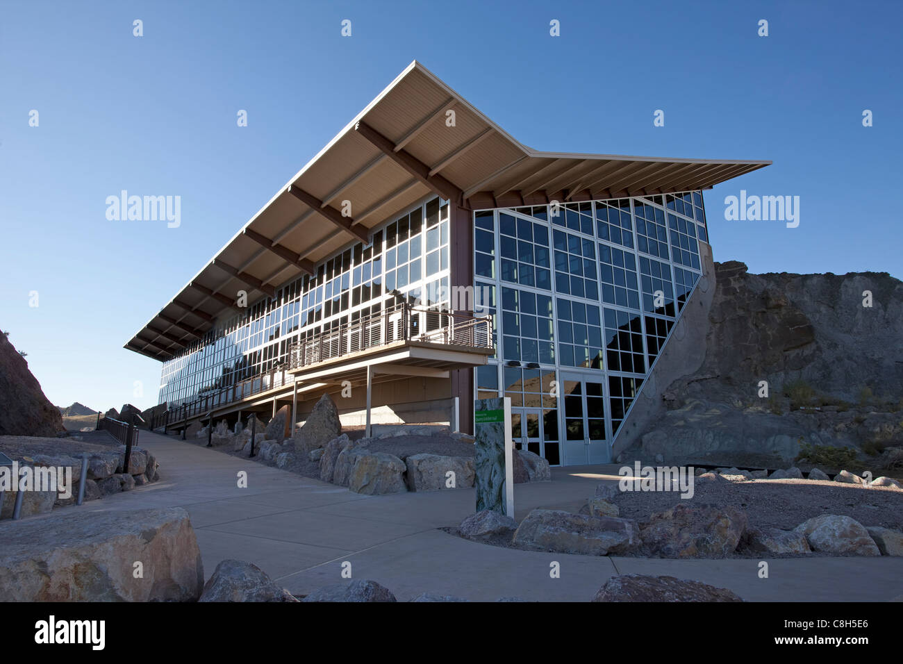 Dinosaur National Monument fossil display building and visitor center. Fossil embedded in rock and stone mountain. Stock Photo